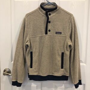Patagonia Shearling Button Pullover rib knit cuffs and hem hand warmer pockets.